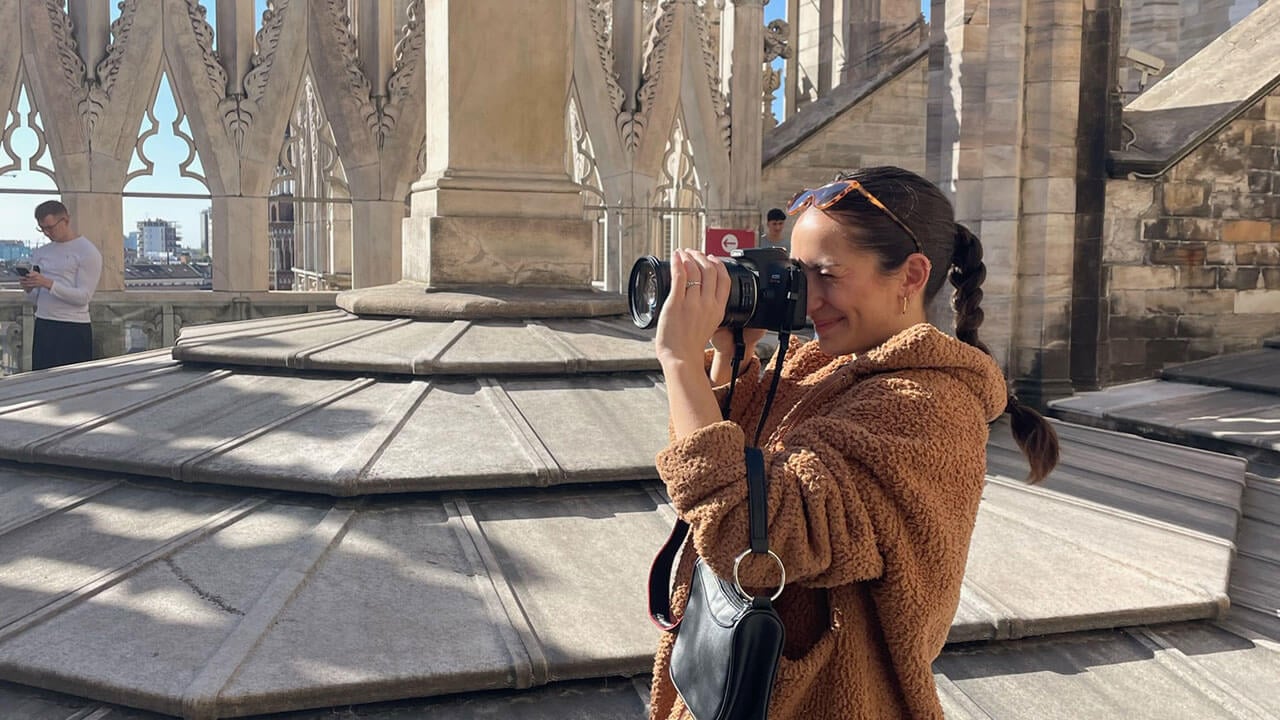 Student takes a photo on top of the Duomo Cathedral in Milan