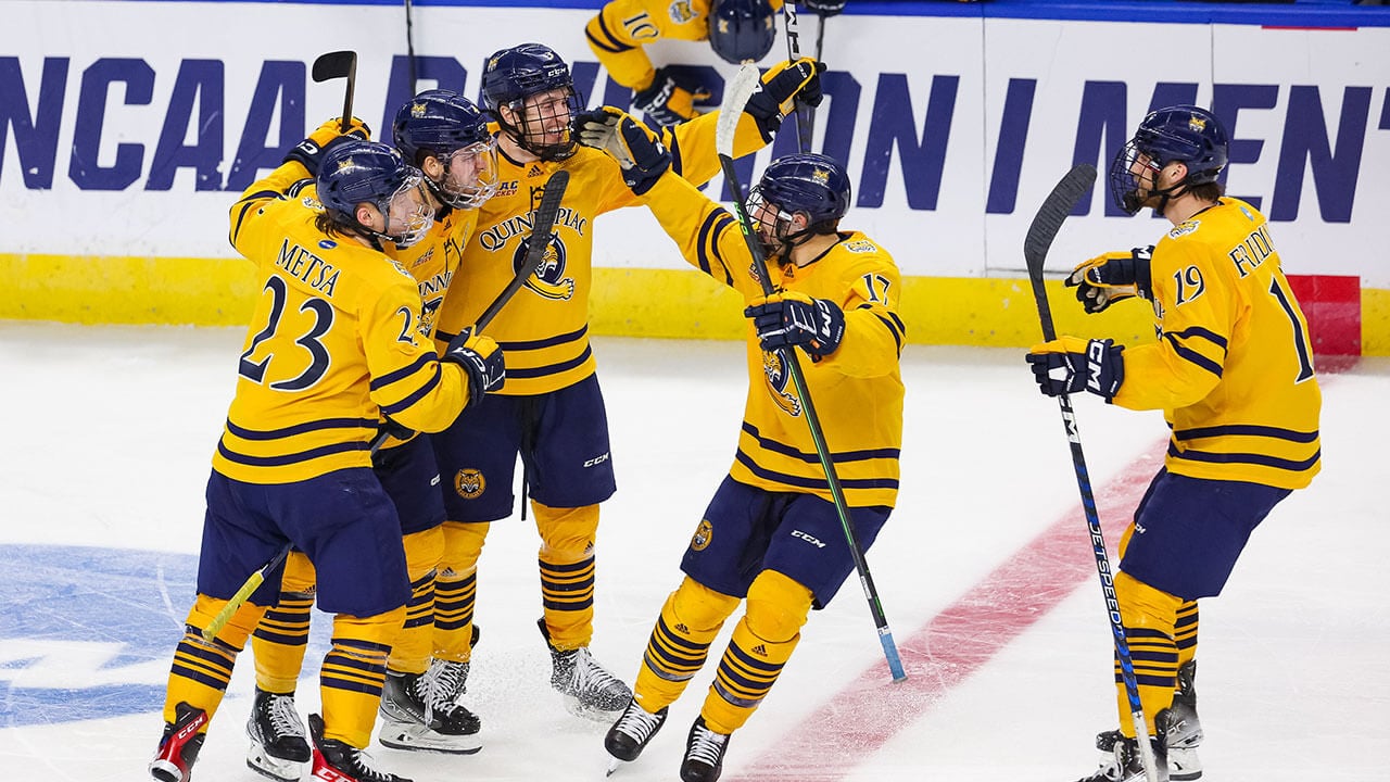 Quinnipiac men's hockey players cheer after scoring a goal during NCAA regional championship play