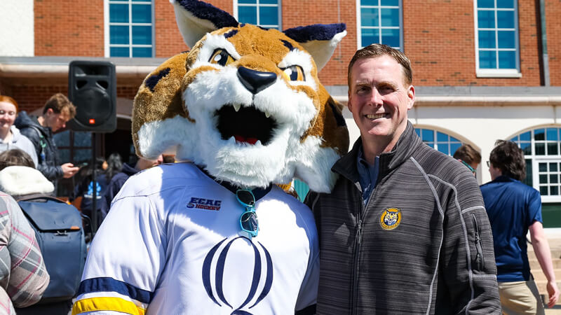 Rand Pecknold and Boomer pose for a photo