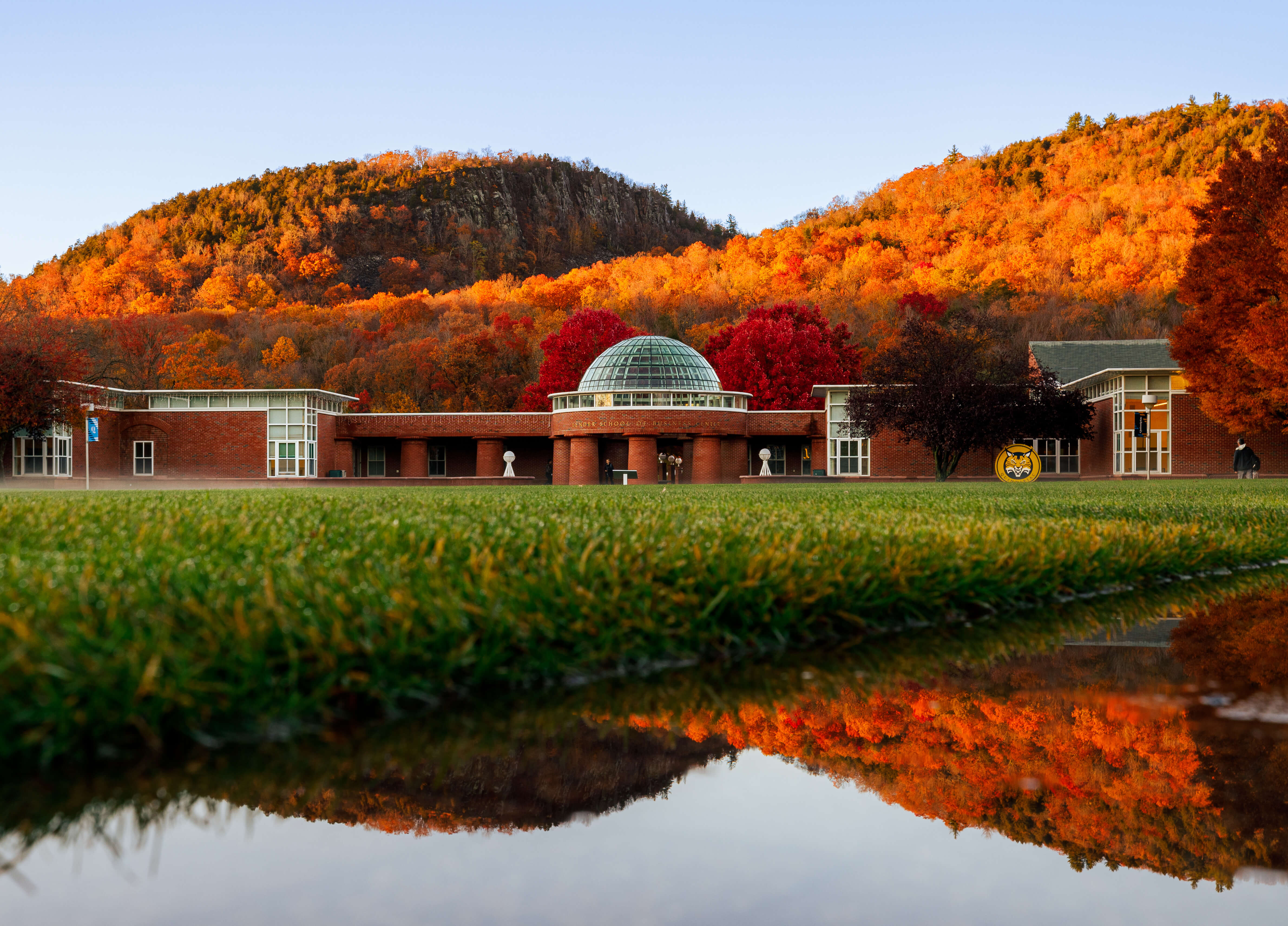 Lender School of Business surrounded by the Fall foliage on the Sleeping Giant.