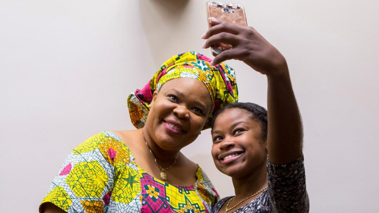 Leymah Gbowee, 2011 Nobel Laureate and Liberian peace activist, smiles for a selfie with Natesha Bestman DNP '17