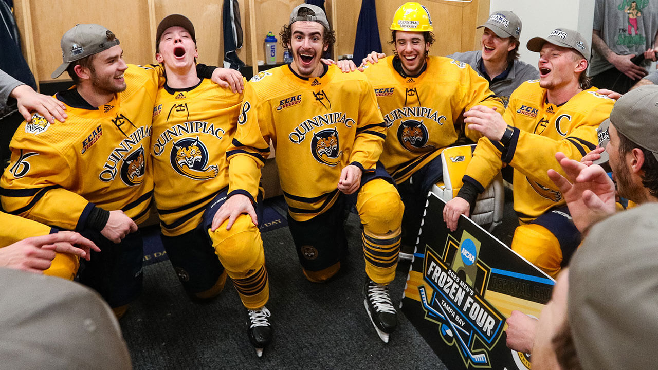 Men's Ice Hockey celebrate victory in the locker room