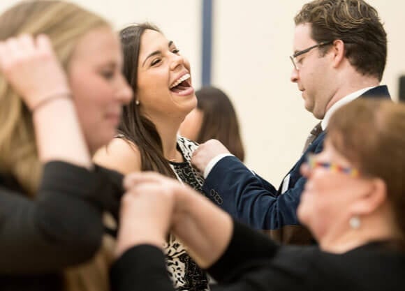 Luciana Macaluso '17 receives her occupational therapy pin on the 100th anniversary of the profession — on May 5 — with 75 other graduates