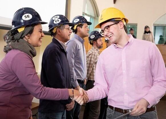 A student is presented a hard hat