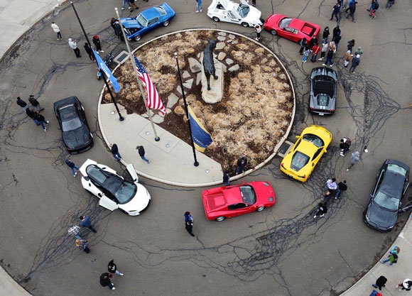 Cars surround the York Hill bobcat statue at the car club's spring show