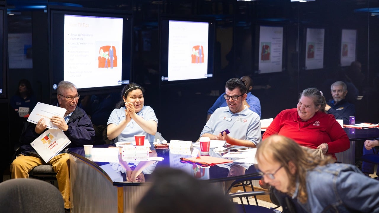 Athletes laugh and work together at Special Olympics Connecticut media training event
