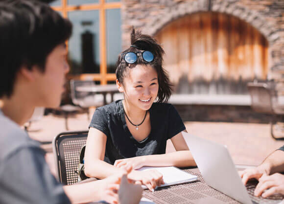 Students study together outside on the Rocky Top Student Center patio