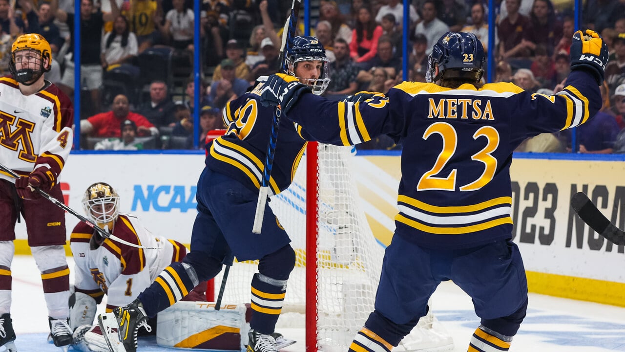 Tellier and Metsa celebrate their goal during the Frozen Four championship game