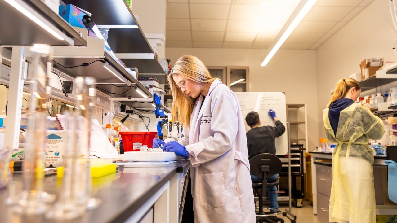 Raegan Brosseau conducts lab research