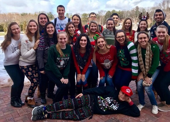 Doctor of physical therapy students don ugly sweaters after completing their finals