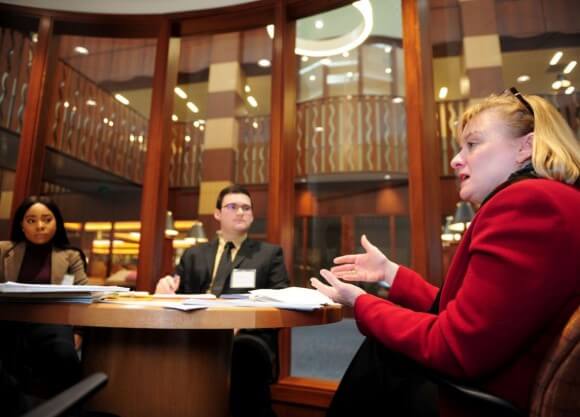 School of Law alum works with first year students during the School of Law's January Term