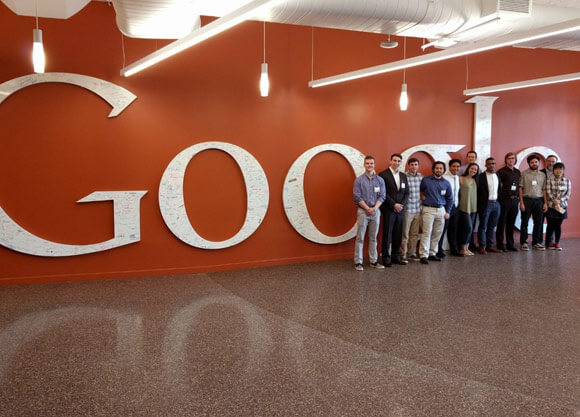 School of Engineering students standing in front of the Google sign
