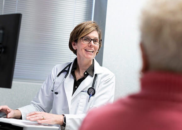 nurse talking to patient