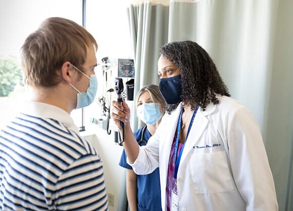 nurse examining patient