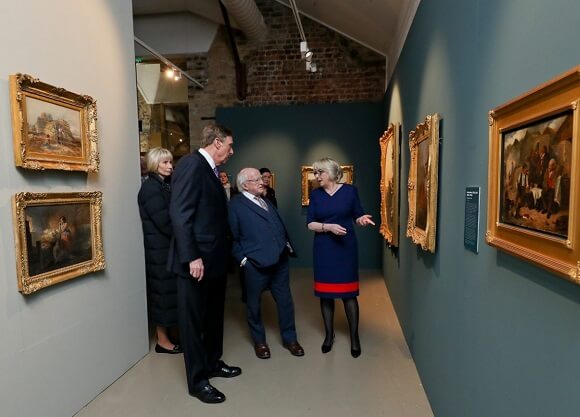 Higgins, Lahey and O'Sullivan walk among a gallery of paintings.