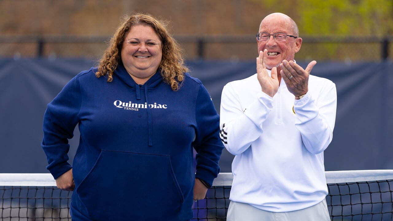 On lookers clap at the Peter Liberti Tennis Complex ceremony