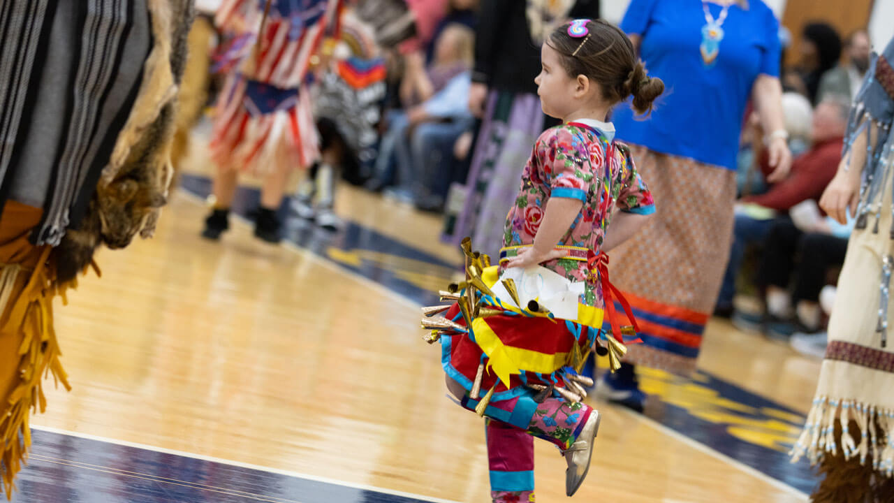 A child in traditional regalia performs at Quinnipiac’s Dancing in the Shadow of Sleeping Giant Powwow