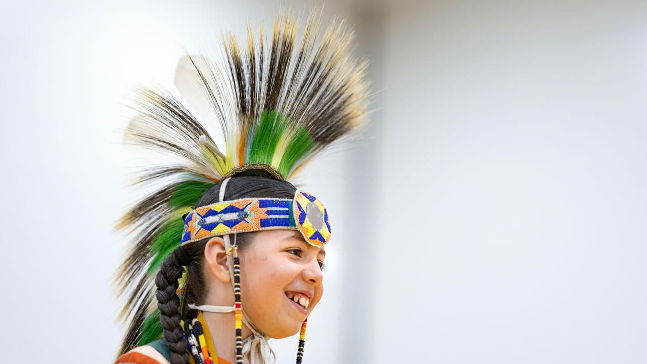 A performer in traditional regalia at the Dancing in the Shadow of Sleeping Giant Powwow held at Quinnipiac