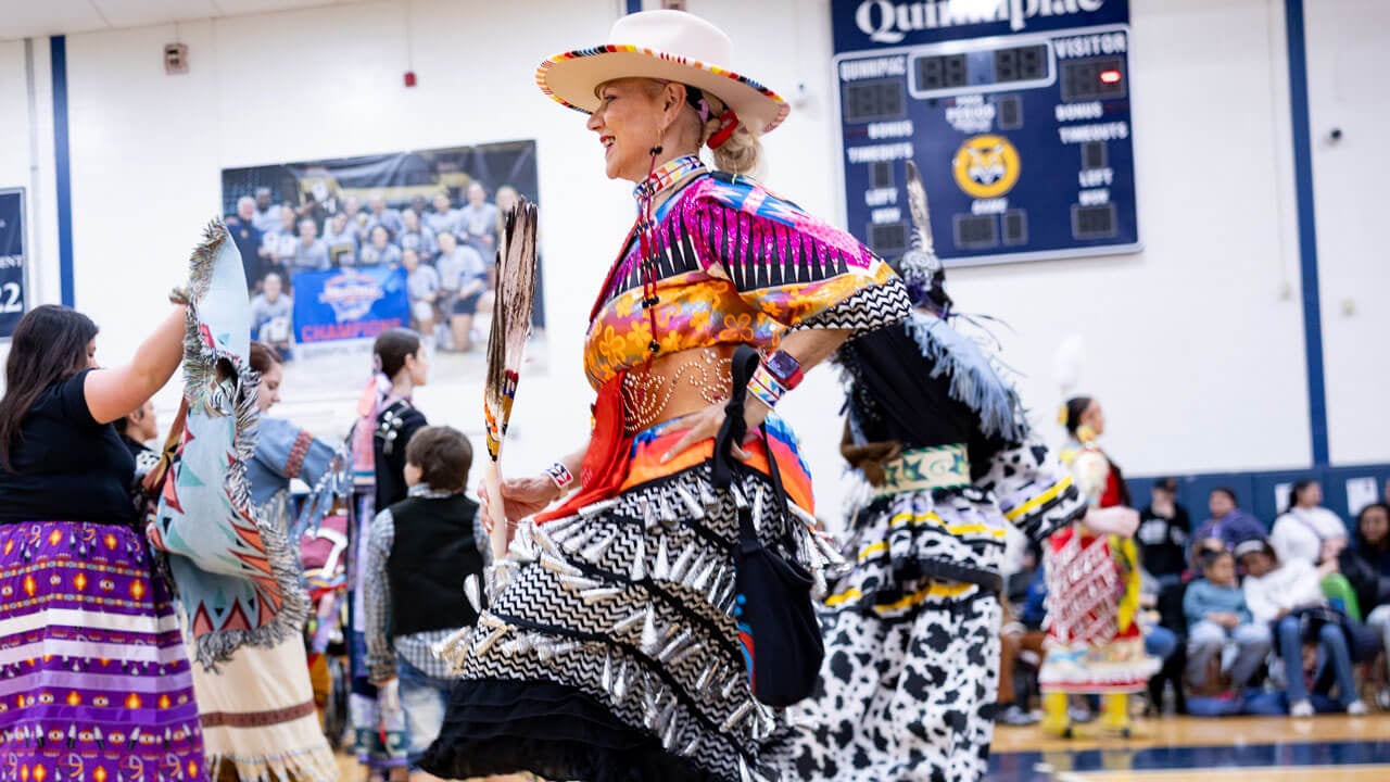 A performer in traditional regalia dances at the Dancing in the Shadow of Sleeping Giant powwow held at Quinnipiac