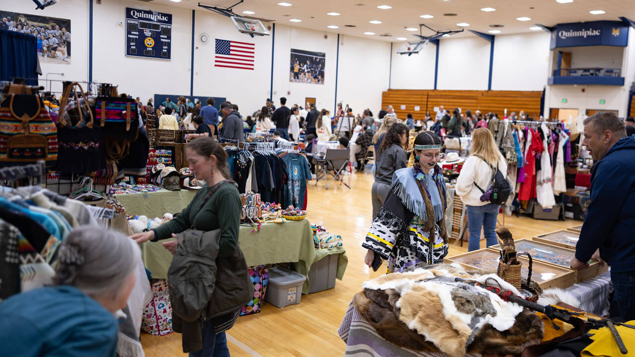 Large crowd forms at the Dancing in the Shadow of Sleeping Giant Powwow held at Quinnipiac