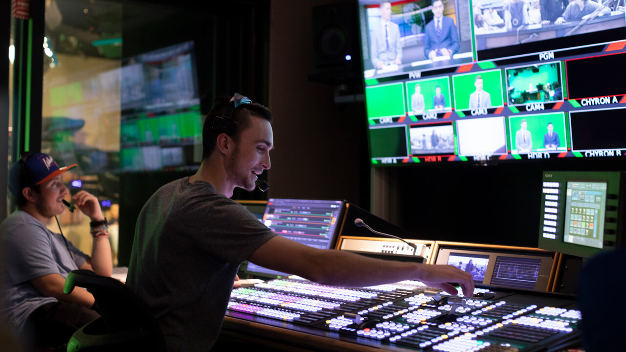 Students working in the control center during a broadcast recording session