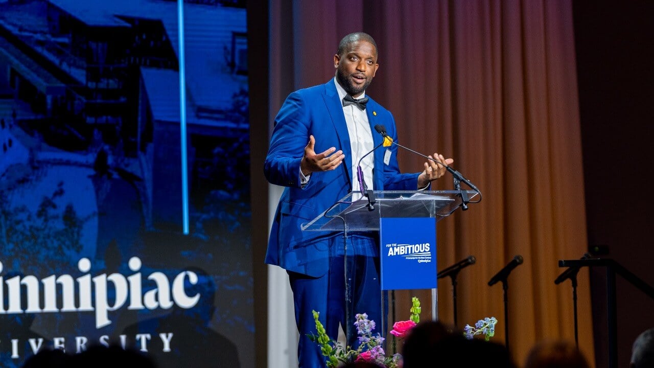 Speaker at the podium at Quinnipiac Gala