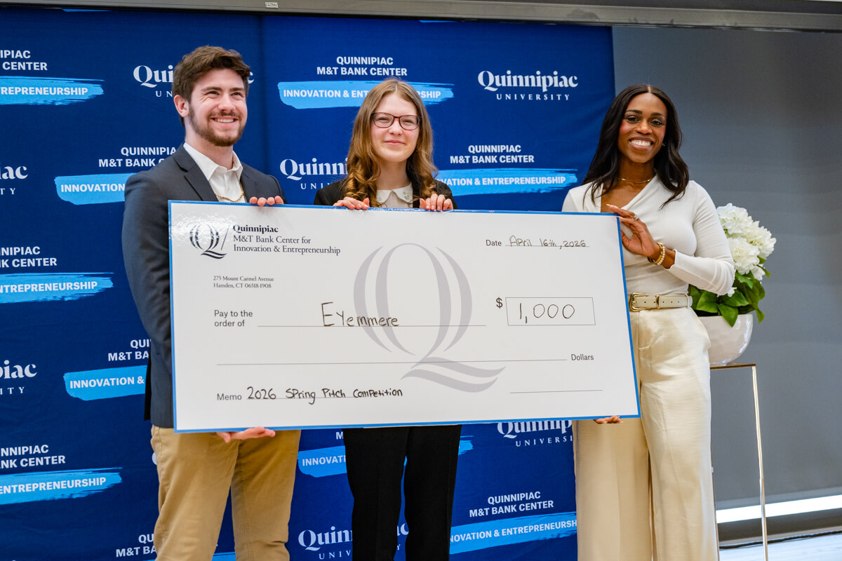 Students hold award winning check