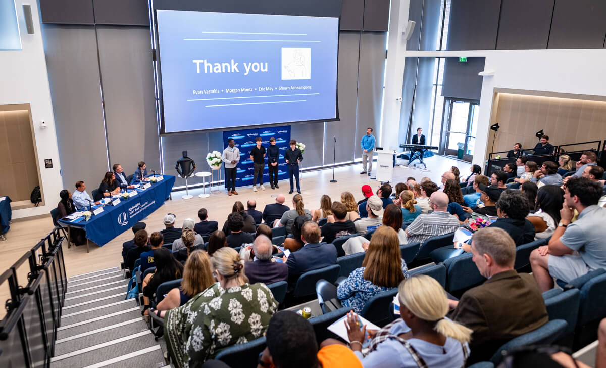 Room view of the packed room and presenters