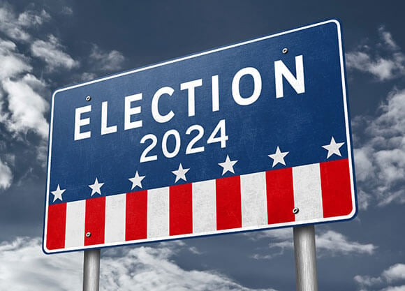 Red, white and blue sign stating Election 2024