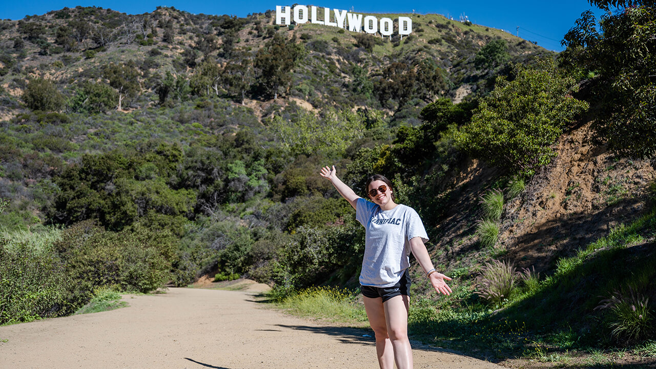 Ephemia Nicolakis in front of the Hollywood sign in Los Angeles