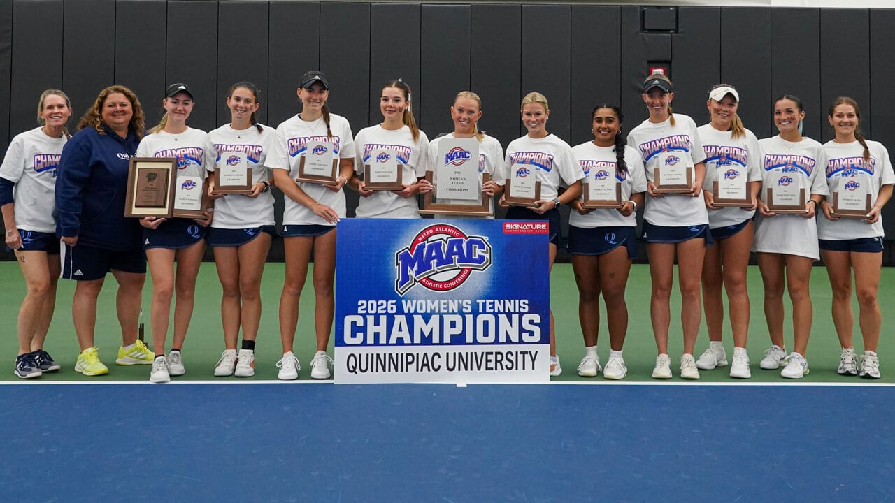 The 2026 Quinnipiac women's tennis team smiles with the MAAC Championship poster