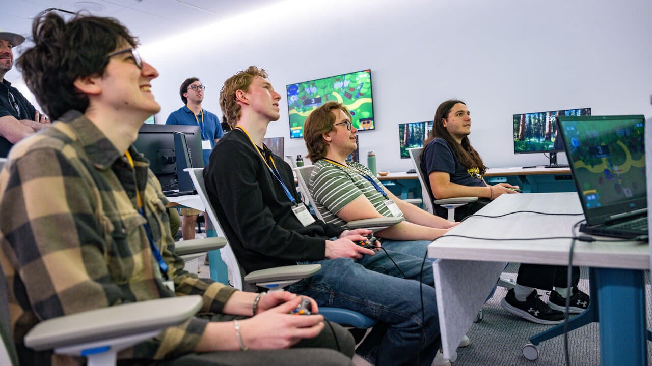 Several students play the game a fellow classmate created
