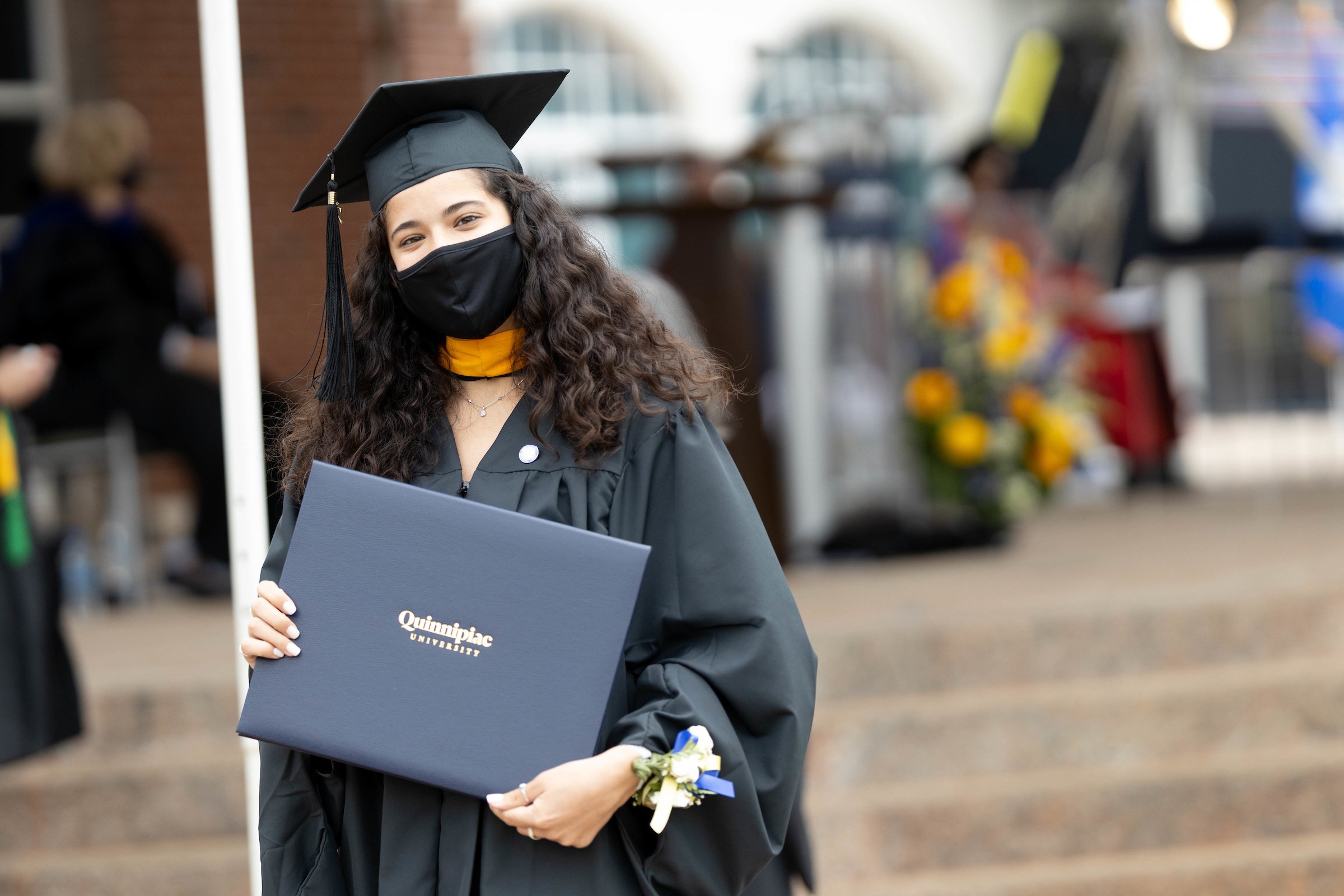 Grad student holding her diploma