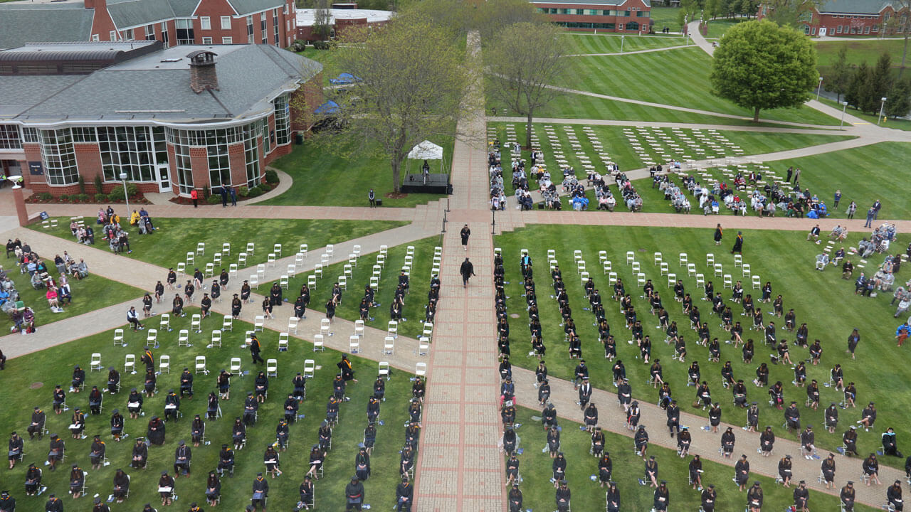 Aerial view of graduates in their seats during Commencement ceremony