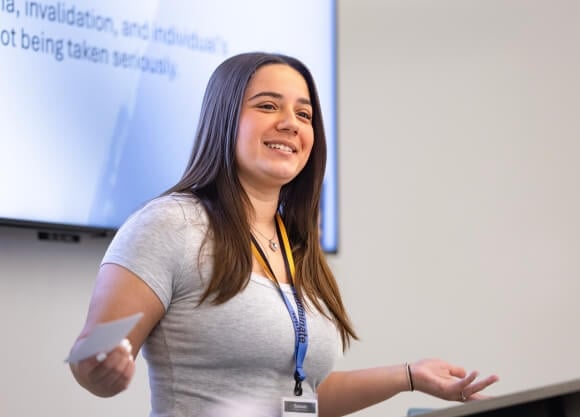 Briana Morris presenting at the Illuminate: The Quinnipiac Student Expo.