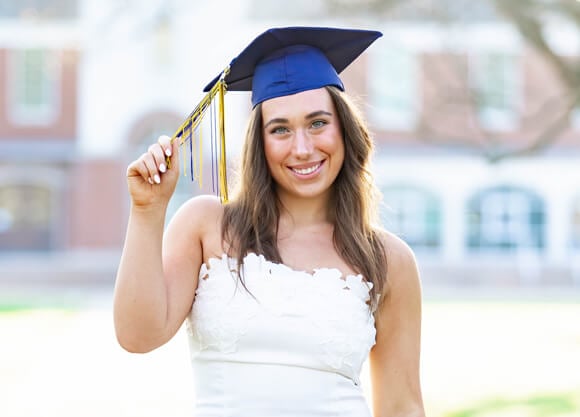 Madison Falhborg poses wearing graduation cap