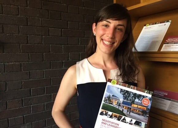 Katie Covett JD ’18 posed with a law brochure.