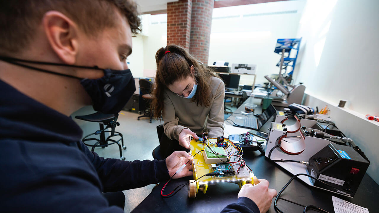 Students work on a mechatronics project