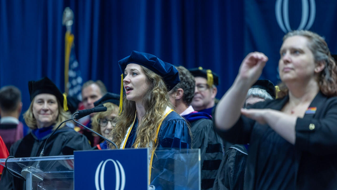School of Law graduate sings the national anthem at the 2024 School of Law Commencement