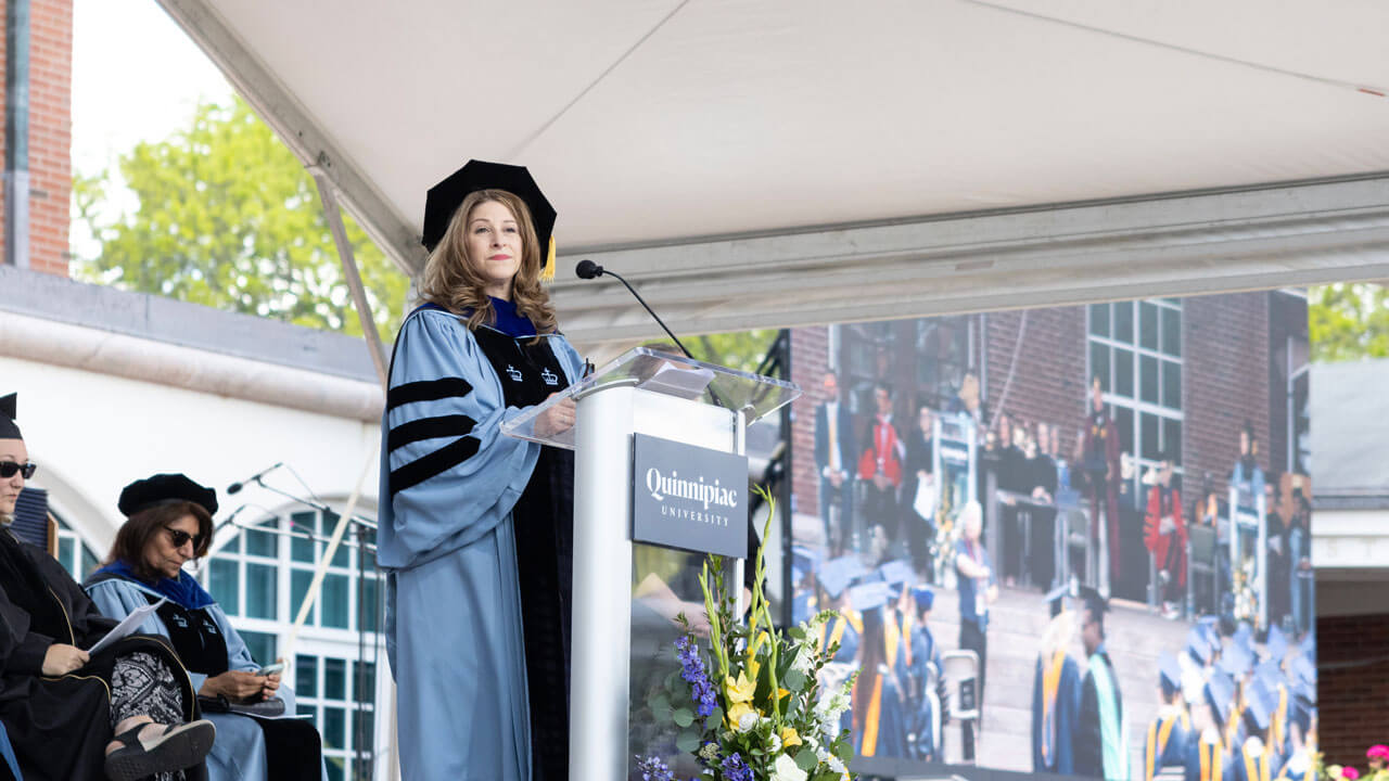 Dean Holly Raider presenting at the 2024 commencement