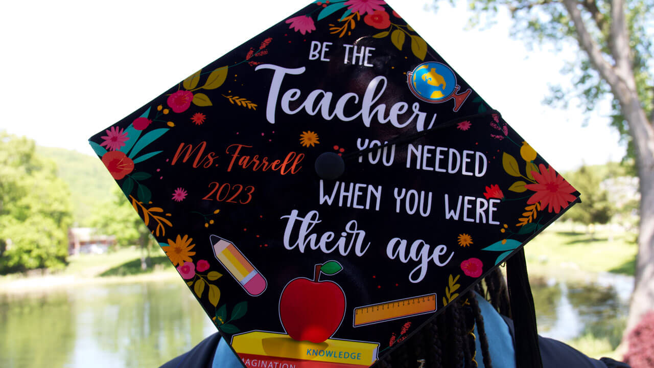 Graduation cap reads 