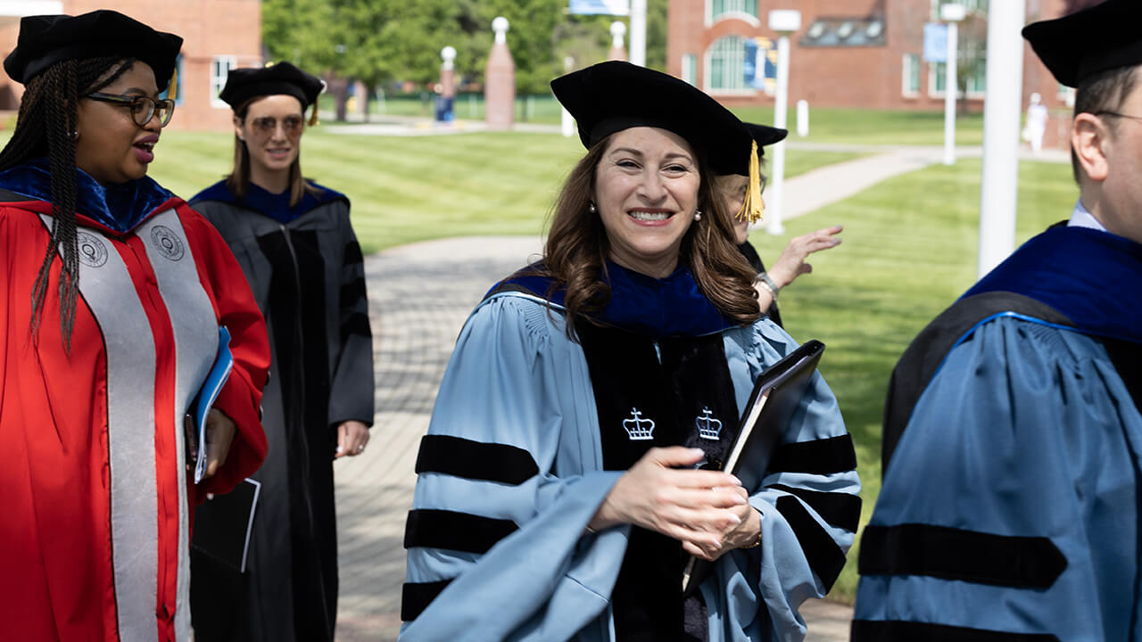 Dean Holly Raider smiles during the procession