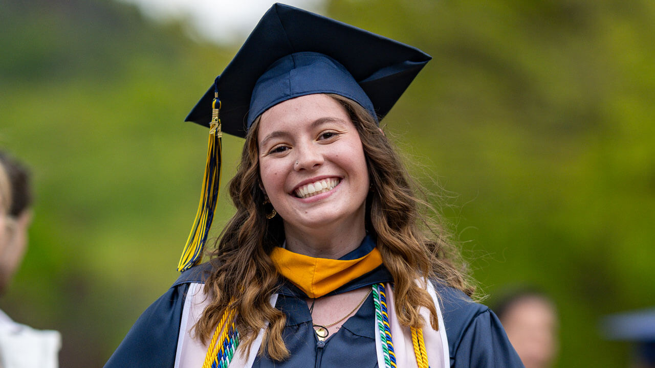 Graduate wearing cap and tassel while smiling