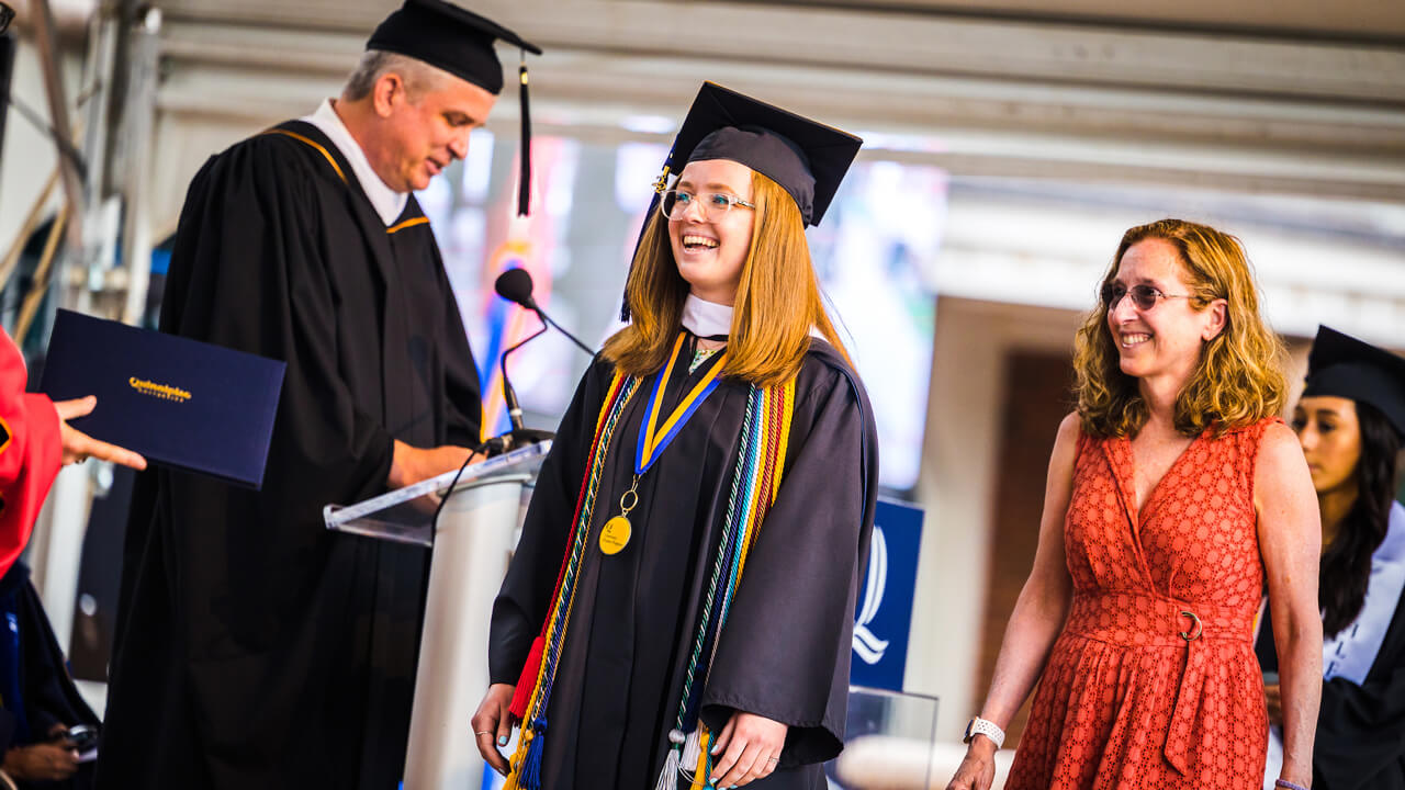Graduate student Victoria Lorenz receives her diploma