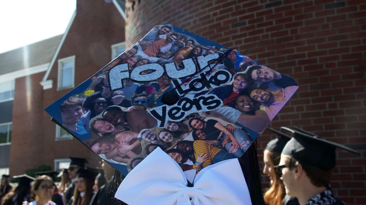 Graduate cap decorated in photos of friends over the years