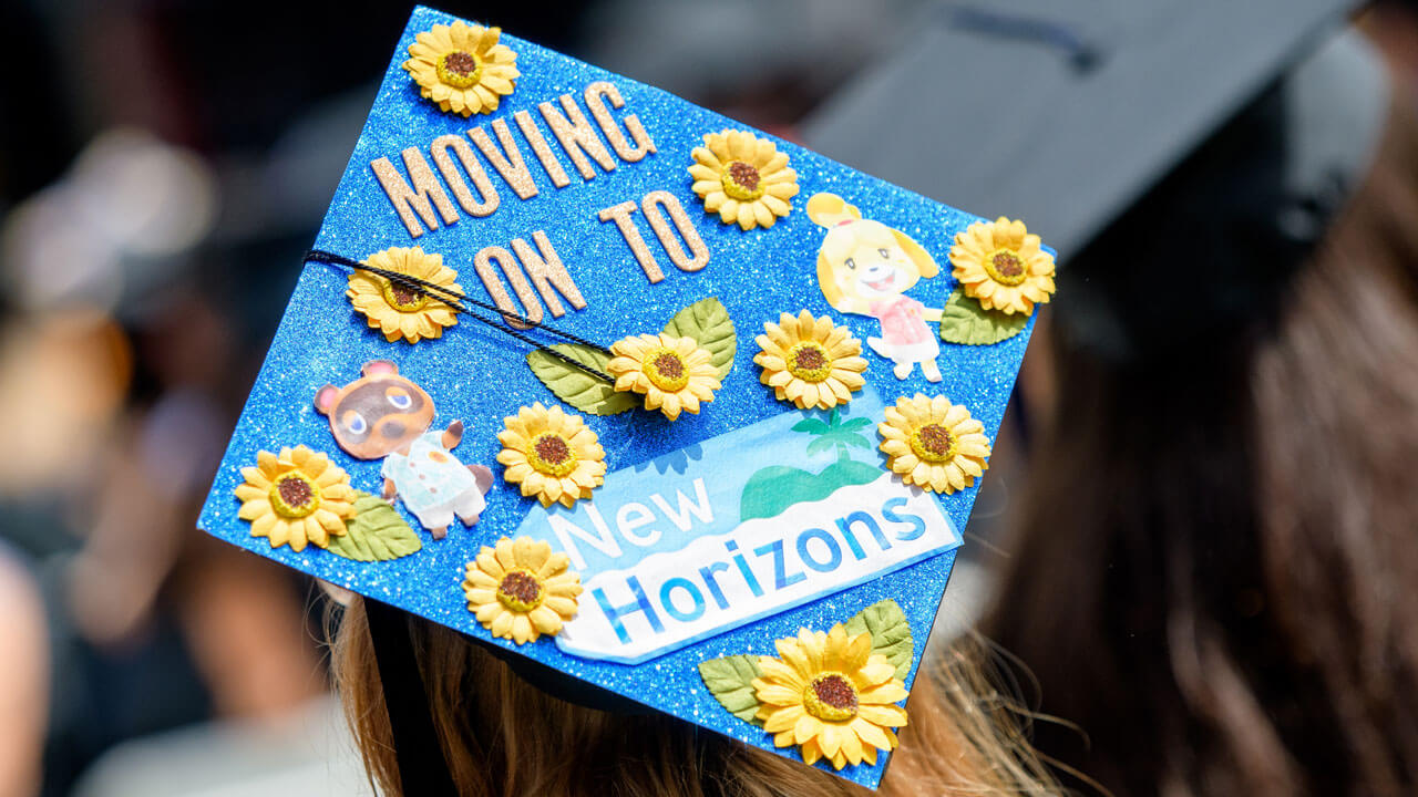 Sparkly blue moving on to new horizons grad cap