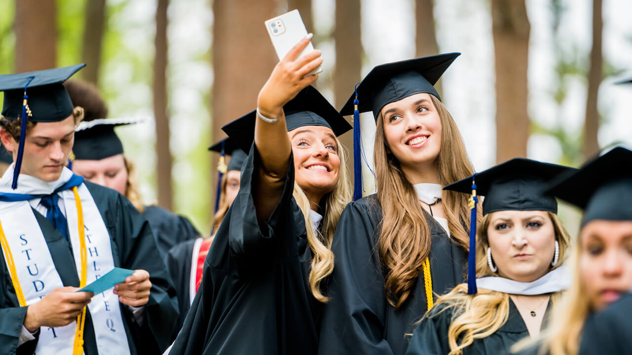 Graduates pose for a selfie