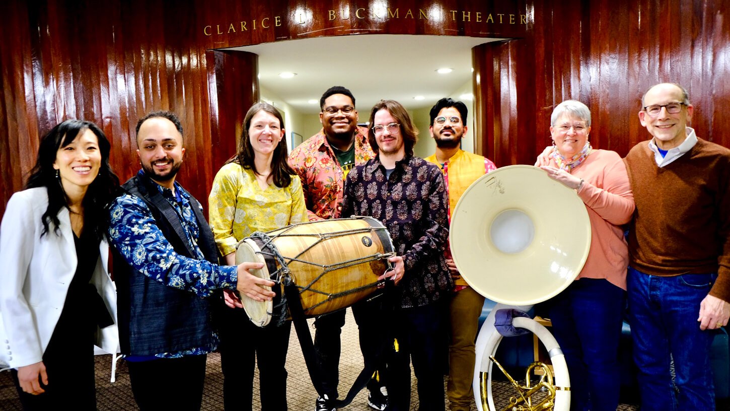 Butter Chicken musicians pose for a group photo with Quinnipiac students, faculty, and staff after the concert.