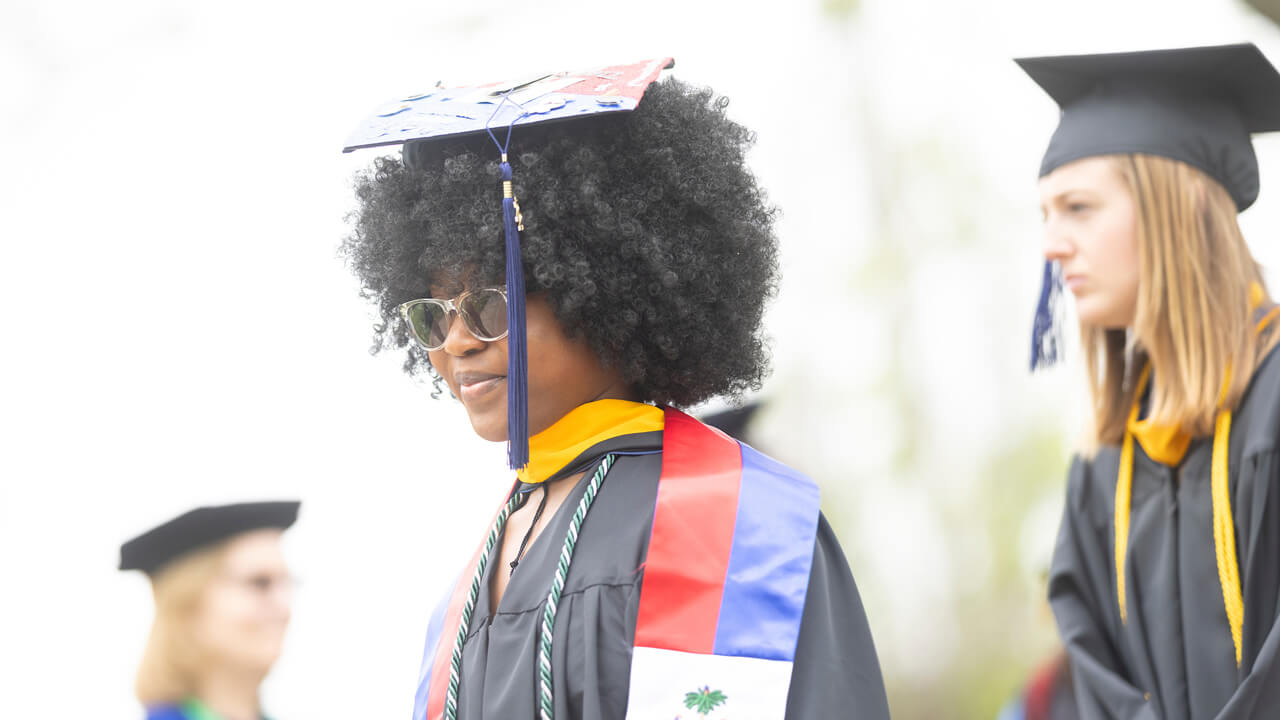 A graduate wearing sunglasses