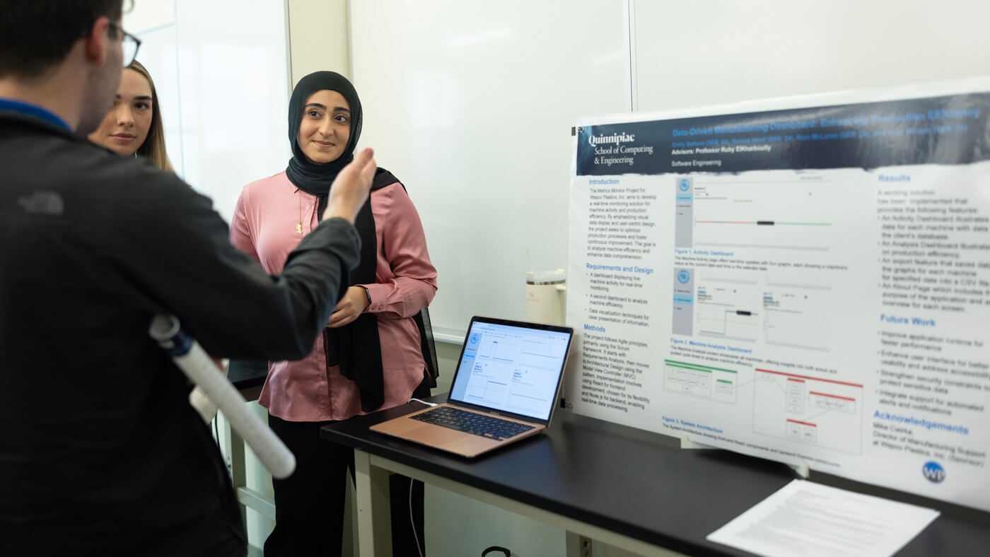 A student presents their research at Projects Day.